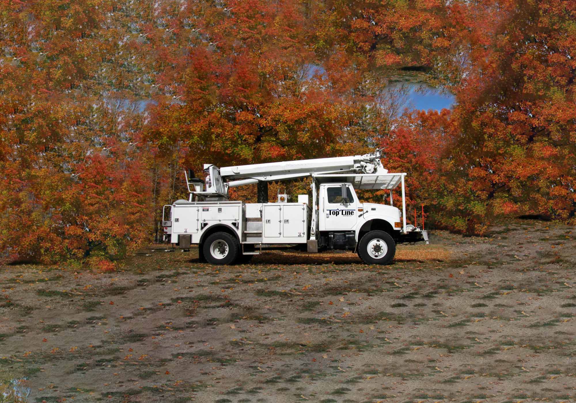 topline electical truck in fall weather with a lift